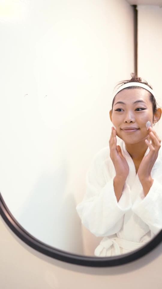Up next, example post: a creator applying moisturizer, seen in a round mirror